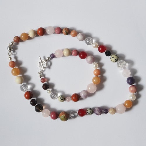 Each One Amelie Bracelet with mixed natural gemstones including Jasper, Quartz, Jade, Amethyst, and pearls. Toggle closure.