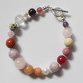 Each One Amelie Bracelet: Mixed natural gemstones including Jasper, Fossil, Quartz, Jade, Garnet, Rose Quartz, Amethyst, and Pearl with toggle closure.
