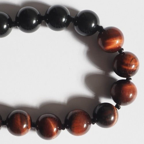 Each One Clara Necklace with red tiger eye and black obsidian beads and sterling silver clasp.
