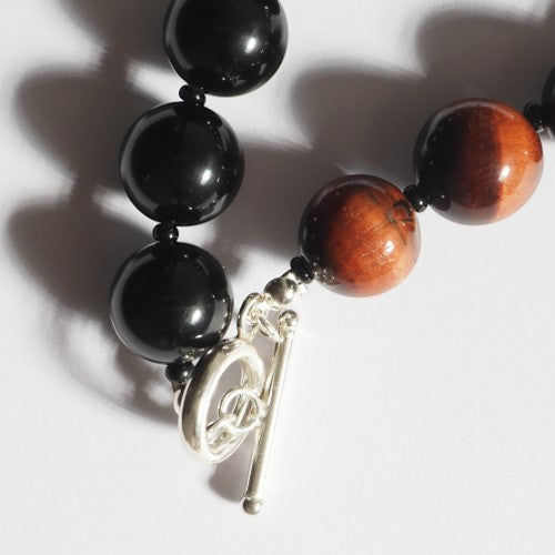 Each One Clara Necklace with red tiger eye and black obsidian beads and sterling silver toggle clasp.