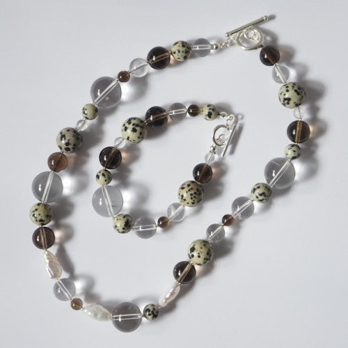 Each One Courtney Necklace with Smoky Quartz, Clear Quartz, Dalmatian Jasper, and pearls. Sterling silver toggle clasp.