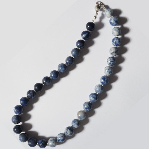 Each One Elara necklace with blue and white marbled sodalite beads and a magnetic clasp.