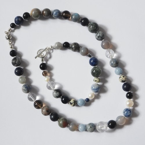 Each One Margot Bracelet with agate, sodalite, obsidian, quartz, lepidolite, sandstone, hawk's eye, jasper and pearl beads. Toggle clasp.