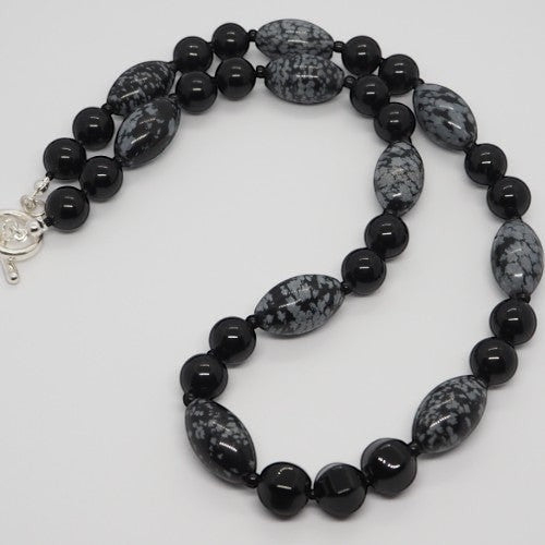 Each One The Rachel Necklace features black obsidian, snowflake obsidian, and black agate beads with a sterling silver toggle clasp.