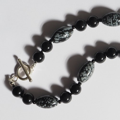 Each One The Rachel Necklace with black obsidian, snowflake obsidian, and black agate beads and sterling silver toggle clasp.